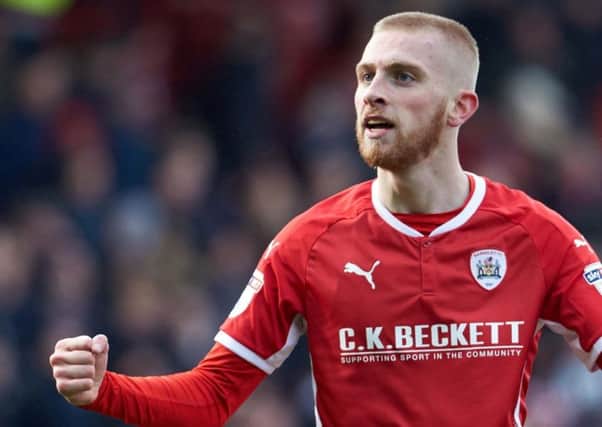 Leeds-born Oli McBurnie, who has scored five times in seven games on loan at Barnsley, has received a call-up into Scotlands squad by manager Alex McLeish.
