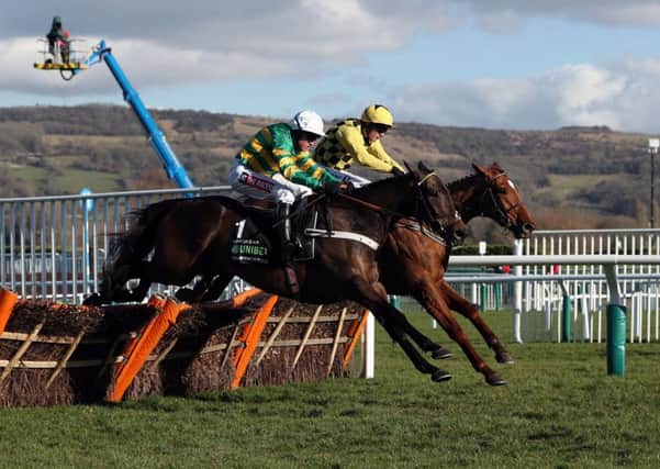 Buveur D'Air, nearsidem, joins battle with Melon at the last flight in the Champion Hurdle.