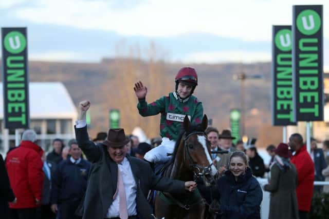 Brian Hughes celebrates on Mister Whitaker after winning the Close Brothers Novices' Handicap Chase at Cheltenham.
