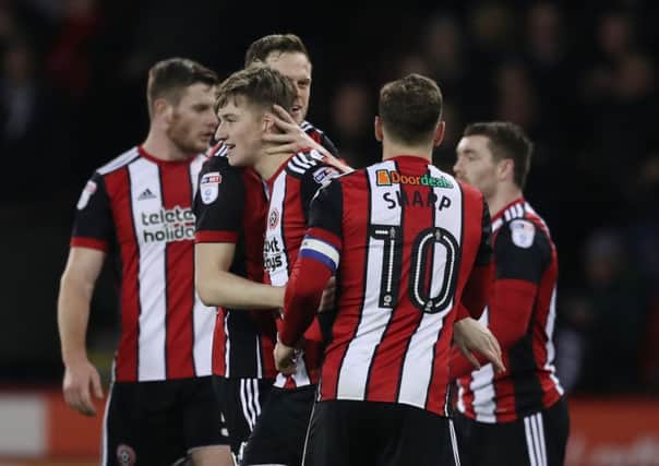 David Brooks is congratulated by his Sheffield United team-mates after scoring against Burton on Tuesday night. Picture:  Simon Bellis/Sportimage