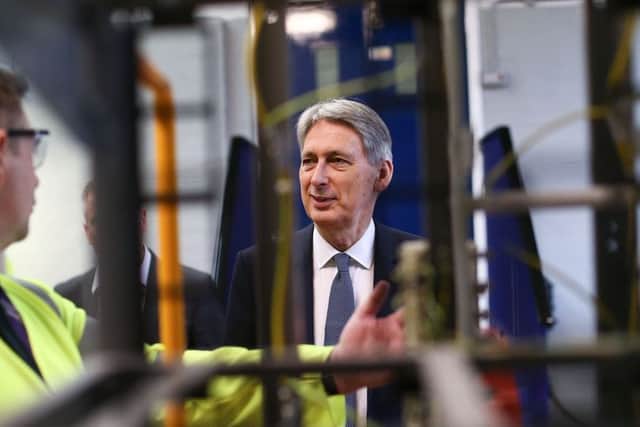 Chancellor Philip Hammond is given a tour of the Openreach training centre and fibre-optic engineering site in Bradford where he announced a Â£67m investments for businesses and homes to benefit from full fibre broadband connectivity.. PRESS ASSOCIATION Photo. Picture date: Thursday March 15, 2018. Photo credit should read: Jan Kruger/PA Wire