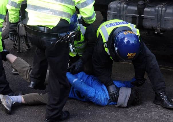Police arrest a tree protester in Sheffield