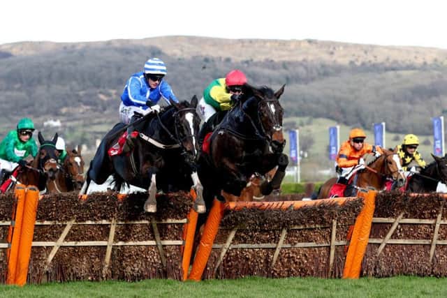 The Willie Mullins-trained Penhill,  left, clears the last in the Stayers' Hurdle.