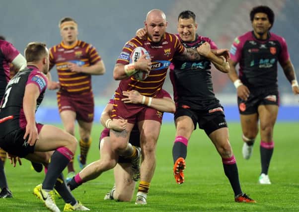 Giants' Dale Ferguson is tackled by Rovers' Andrew Heffernan and Danny McGuire.