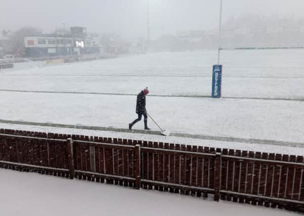 Wakefield chairman Michael Carter clears the lines before his side's abandoned match with Widnes. Picture: Peter Smith.