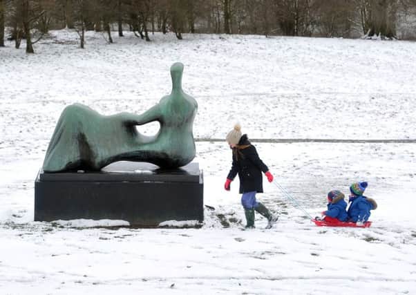 18 March 2018......   Lylah Shenton with Archie and Oliver Steel play in the snow at the Yorkshire Sculpture Park. Picture Tony Johnson.