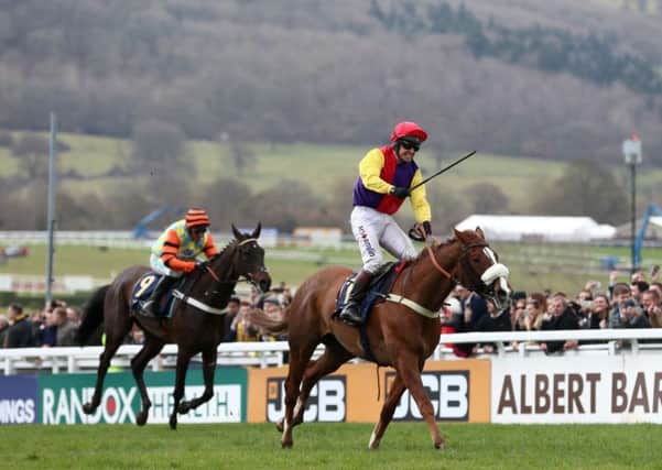 Jockey Richard Johnson on board Native River (right) goes on to win the Timico Cheltenham Gold Cup.