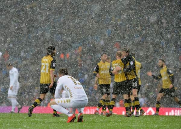 Stuart Dallas looks on in dismay as Sheffield Wednesday celebrate their win at Leeds United (Picture: Bruce Rollinson).