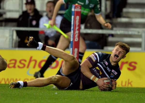 Ash Handley touches down for the Rhinos third try. Picture Bruce Rollinson