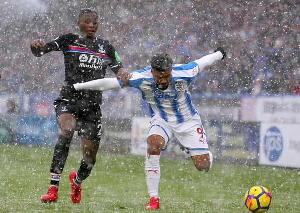 Crystal Palace's' Osman Kakay (left) and Huddersfield Town's Elias Kachunga during the Premier League match at the John Smith's Stadium, Huddersfield. (Picture: Richard Sellars/PA)