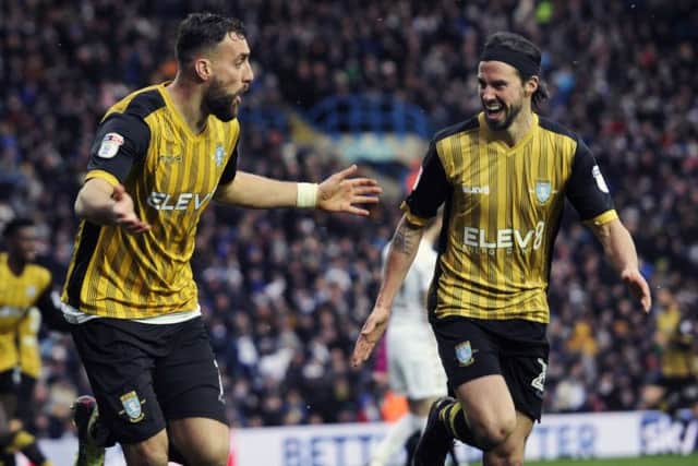Two-goal Atdhe Nuhiu, left, shows his delight as does team-mate George Boyd as Sheffield Wednesday won at Leeds United (Picture: Steve Ellis).