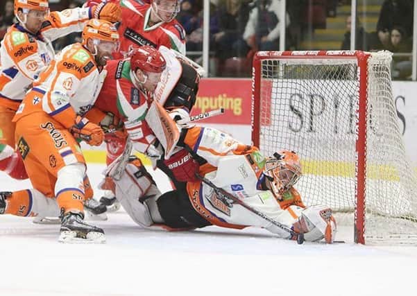AND STAY OUT! Sheffield Steelers' netminder Ervins Mustukovs sprawls to his left to keep the puck out at Ice Arena Wales. Picture: Helen Brabon.