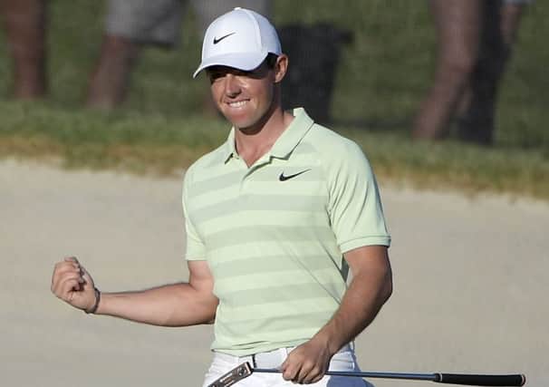 Rory McIlroy, of Northern Ireland, celebrates after making a birdie on the 18th green during the final round of the Arnold Palmer Invitational golf tournament. (AP Photo/Phelan M. Ebenhack)