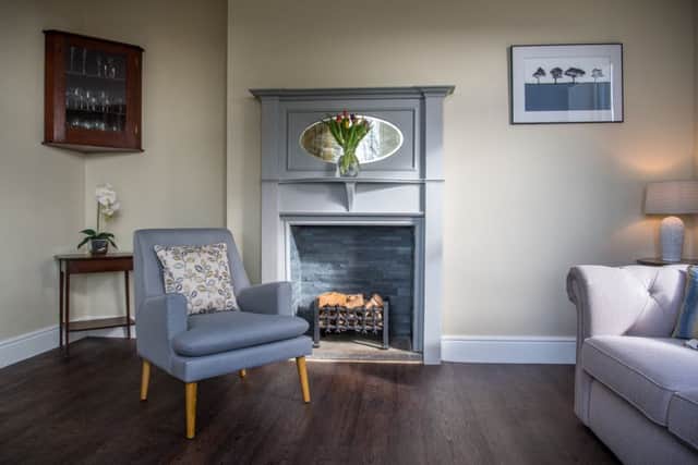 Whatw as an exhibition room is now a cosy drawing room for guests. The fireplace was uncovered and a vintage surround bought and painted in Annie Sloan chalk paint by Sally.