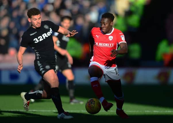 Barnsley's Andy Yiadom with Leeds United's Kalvin Phillips.