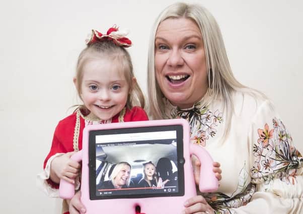 Julie Britton with her daughter Connie-Rose Seabourne who has Down Syndrome, who have appeared on a James Corden-backed carpool karaoke video that has gone viral with over a million of views. PIC: PA