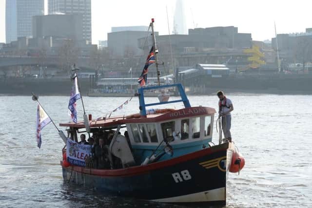 The Fishing for Leave boat on the Thames in London, before they plan to dump fish in the river opposite the Houses of Parliament in a symbolic demonstration against the Government's Brexit transition deal.