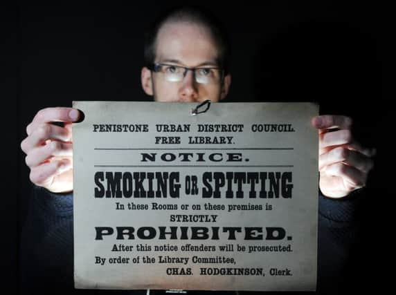 Barnsley Archive's David Blunden with signage taken from Pensitone Library. Picture: Scott Merrylees