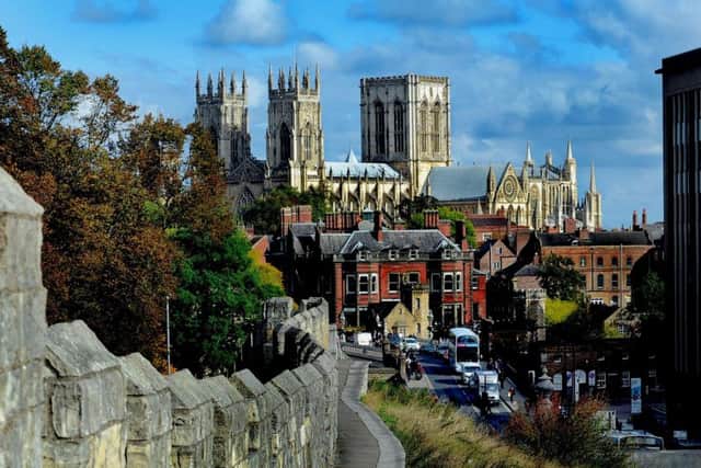 Date:20th October 2015. Picture James Hardisty. Possible Picture Post.......Pictured Standing out from the crowd the magnificent York Minster seen from the winding path of the York City Walls near York Railway Station.  Camera Details: Nikon D3's, Lens 70-200mm, Shutter Speed 1/320s, Aperture f/8, ISO 0.7 EV under 200.