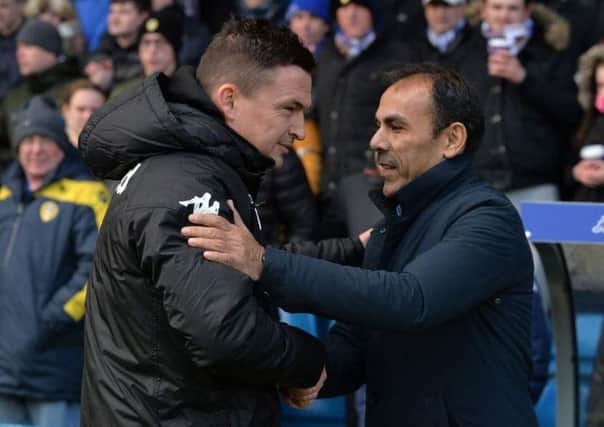 UNDER PRESSURE: Paul Heckingbottom and Jos Luhukay meet before Saturday's Yorkshire derby at Elland Road which the Owls won 2-1.