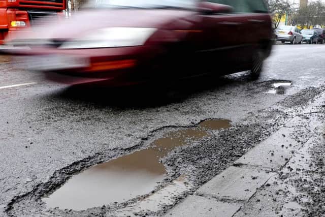 The millions of potholes which scar our towns, cities and countryside are a growing problem that need an urgent solution. (PA).