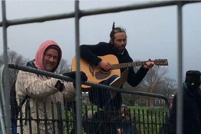 Benoit Compin has been performing on his guitar at tree-felling protests.