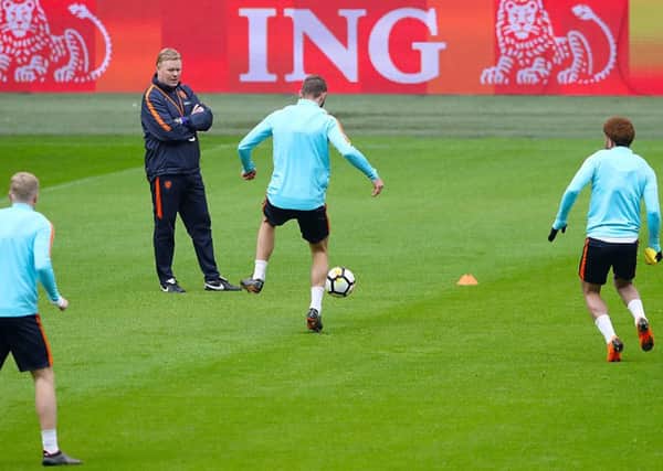 Going Dutch: Netherlands Manager Ronald Koeman watches the players during a training session in Amsterdam.
