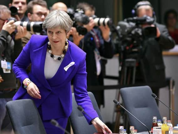 British Prime Minister Theresa May arrives for a round table meeting at an EU summit at the Europa building in Brussels today. (AP Photo/Geert Vanden Wijngaert)