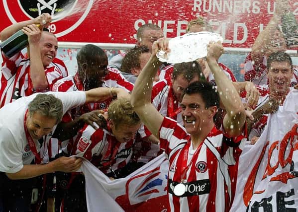 Happy days: Sheffield United's Chris Morgan celebrates with the Championship runners-up plate with team-mates after the match against Crystal Palace at Bramall Lane in April, 2006.