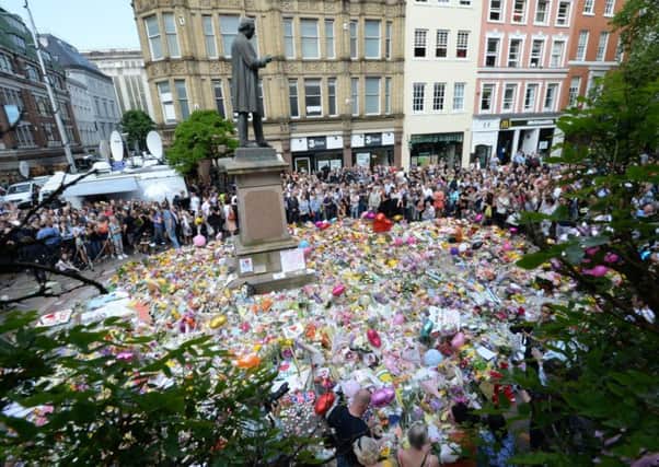 Tributes were paid at St Ann's Square, Manchester, to remember the victims of the terror attack at the Manchester Arena last year. The attack shocked people and showed the threat level in Britain is still high. (PA)