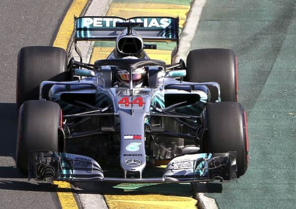 Mercedes driver Lewis Hamilton runs over the ripple strip in turn 2 during the second practice session at the Australian Formula One Grand Prix in Melbourne.