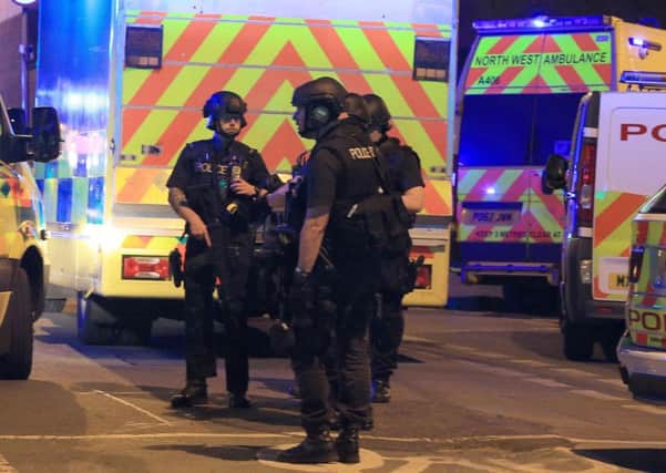 Armed police at Manchester Arena last May.