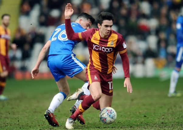 Bradford's Alex Gilliead is fouled by Gillingham's Callum Reilly.
(
Pictures: Jonathan Gawthorpe)
