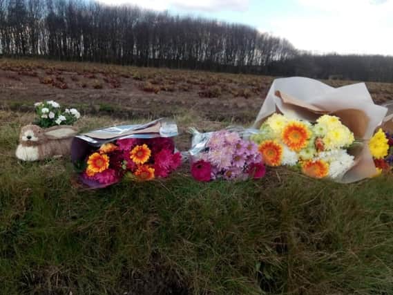 Floral tributes at the scene of the fatal crash