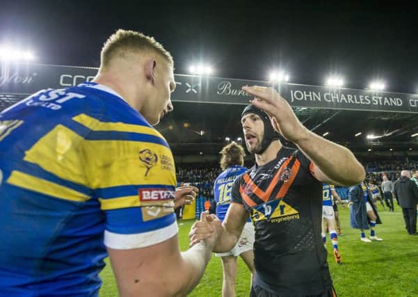 Castleford's Luke Gale consoles Leeds players after their victory at Elland Road.
