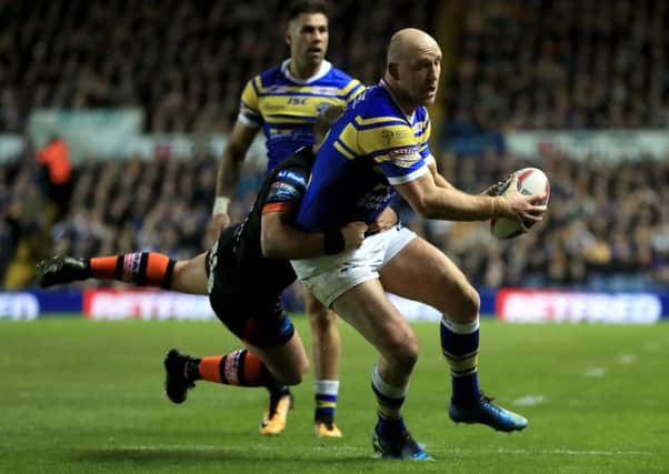 Leeds Rhinos' Carl Ablett is tackled by Castleford Tigers' Paul McShane.