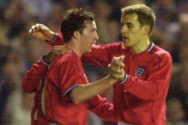 England's Robbie Fowler celebrates with Phil Neville (R) after scoring against Italy at Elland Road in 2002 (Picture: PA)