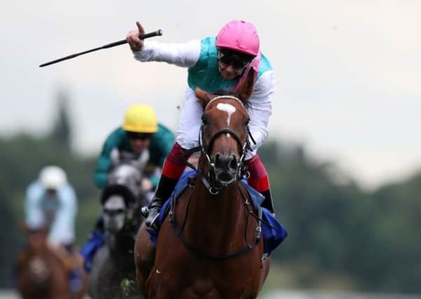 Frankie Dettori and Enable cross the line after winning the Yorkshire Oaks.