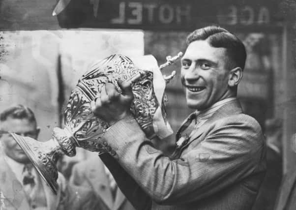 Wembley, 11th May 1934

Hunslet captain Jack Walkington holds the Rugby League Challenge Cup in 1934.