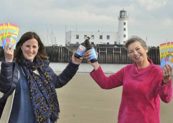 Wold Top Brewery Manager Kate Balchin and Books by the Beach organiser Heather French.