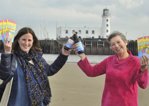 Wold Top Brewery Manager Kate Balchin and Books by the Beach organiser Heather French.