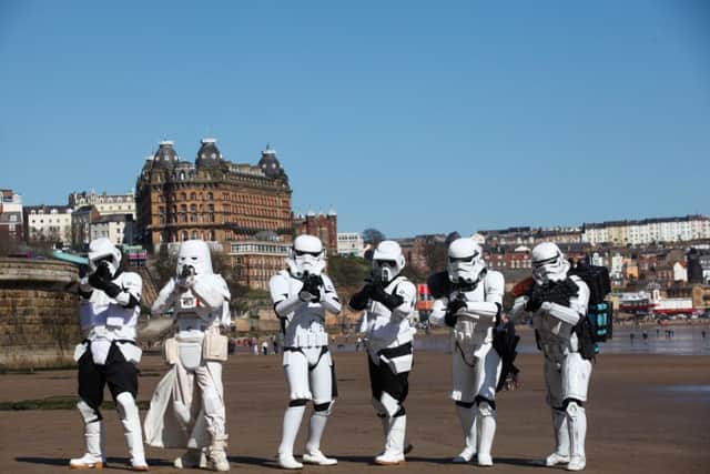 Stormtroopers from Sentinal Squad UK invade the beach on day two of Scarborough Sci Fi convention at the Spa.