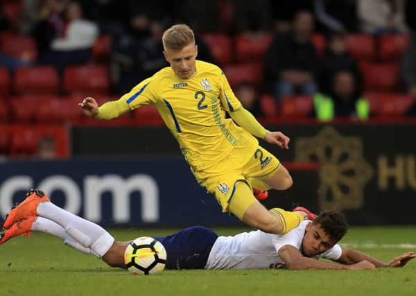 England Under-21s' Dominic Calvert-Lewin is sent sprawling in a challenge with Ukraine Under-21s' Pavlo Lukyanchuk at Bramall Lane (Picture: Mike Egerton/PA Wire).