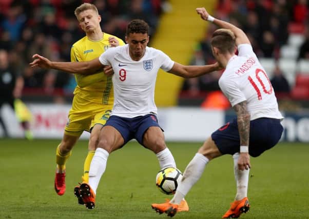 England Under-21s' Dominic Calvert-Lewin, centre, and James Maddison battle with Ukraine Under-21s' Pavlo Lukyanchuk at Bramall Lane (Picture: Mike Egerton/PA Wire).