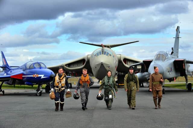 From left: Andy Stamp  WW2 , Charles Hancock 1950/60's, Sandrine Bauchet, present day, Yoan Martin  1980s  and Gary Hancock, WW1, with in the  background a T7 Hawker Hunter trainer 1950's,  Handley page Victor Bomber 1960's and a prototype Tornador GR4.