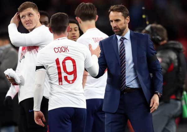 England's Lewis Cook (left) and manager Gareth Southgate after the international friendly match at Wembley Stadium, London.