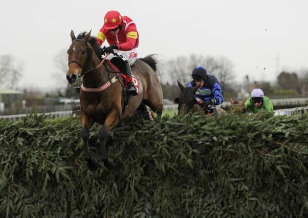 Highland Lodge and Henry Brooke win the 2015 Becher Chase at Aintree.