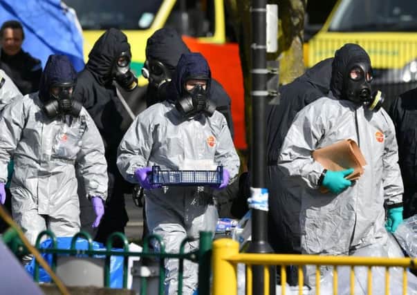 Police in protective suits at the scene of the Salisbury poisonings.