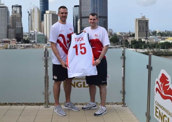 Mike Tuck, left, is presented with his Team England vest in Brisbane (Picture: Basketball England)