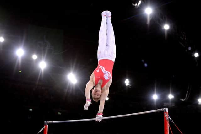 England's Nile Wilson on his way to winning the gold medal during the Men's Horizontal Bar Final in 2014. (Pictures: PA)